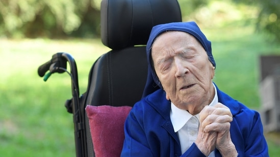 Sister Andre, Lucile Randon in the registry of birth, the eldest French and European citizen, prays in a wheelchair, on the eve of her 117th birthday.(AFP file)