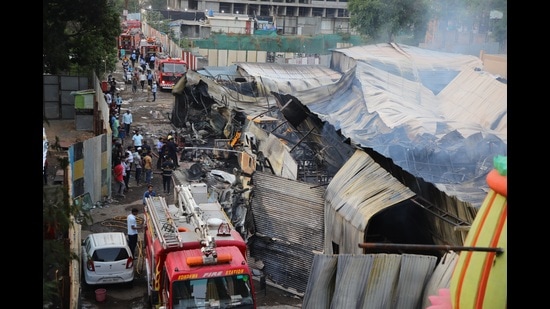 A major broke out at a furniture warehouse at Pargenagar in Kondhwa on Tuesday. Ten water tankers were pressed into action to douse the fire. No injuries were reported. (HT PHOTO)