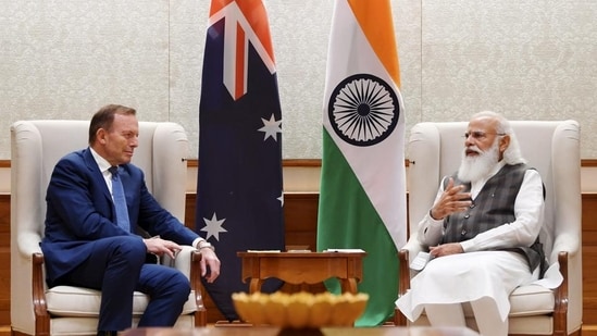 File photo of PM Modi with Australia’s special trade envoy Tony Abbott during a meeting in New Delhi. (PTI PHOTO.)