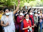 Members of the All India Institute of Medical Sciences (AIIMS) Nursing Union raise slogans as a part of an indefinite strike against the AIIMS administration. (ANI ) Members of the All India Institute of Medical Sciences (AIIMS) Nursing Union raise slogans as a part of an indefinite strike against the AIIMS administration. (ANI )