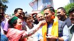New Himachal PCC chief Pratibha Singh offers sweets to her son Vikramaditya Singh in Shimla on Wednesday. (Deepak Sansta/HT) New Himachal PCC chief Pratibha Singh offers sweets to her son Vikramaditya Singh in Shimla on Wednesday. (Deepak Sansta/HT)