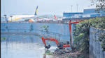 Mumbai, India - April 27, 2022: As part of pre-monsoon desilting, BMC workers clean up the Mithi River close to the international airport before the onset of monsoon, at Andheri, in Mumbai, India, on Wednesday, April 27, 2022. (Photo by Vijay Bate/HT Photo) (HT PHOTO) Mumbai, India - April 27, 2022: As part of pre-monsoon desilting, BMC workers clean up the Mithi River close to the international airport before the onset of monsoon, at Andheri, in Mumbai, India, on Wednesday, April 27, 2022. (Photo by Vijay Bate/HT Photo) (HT PHOTO)