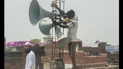 Workers remove loudspeakers from a religious building, in Gorakhpur, on Wednesday. The Uttar Pradesh government has ordered the removal of loudspeakers from all religious sites while raising awareness on noise pollution. (PTI Photo) Workers remove loudspeakers from a religious building, in Gorakhpur, on Wednesday. The Uttar Pradesh government has ordered the removal of loudspeakers from all religious sites while raising awareness on noise pollution. (PTI Photo)