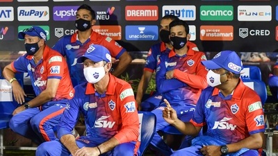 Delhi Capitals coaches Ricky Ponting, Ajit Agarkar and Praveen Amre and others sit at the team dugout (IPL) Delhi Capitals coaches Ricky Ponting, Ajit Agarkar and Praveen Amre and others sit at the team dugout (IPL)