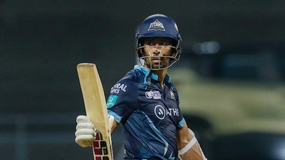 Wriddhiman Saha raises his bat after scoring a fifty (PTI) Wriddhiman Saha raises his bat after scoring a fifty (PTI)