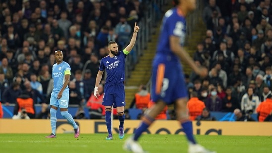 Karim Benzema celebrates after scoring his side's third goal during the Champions League semi final (1st leg) against Manchester City(AP)