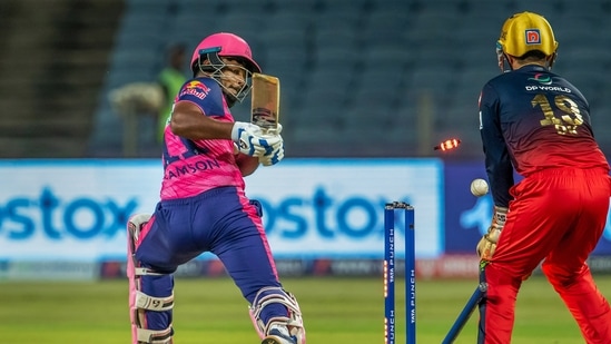 Sanju Samson of Rajasthan Royals is bowled out by Wanindu Hasaranga of Royal Challengers Bangalore during the IPL 2022 cricket RCB vs RR match(PTI)