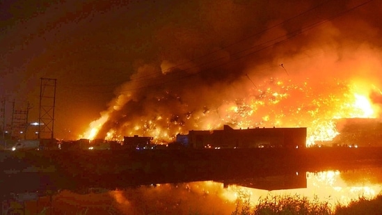 The fire department received information about the blaze around 5.47 pm following which 10 fire tenders were rushed to the spot.(HT Photo/Sanchit Khanna)