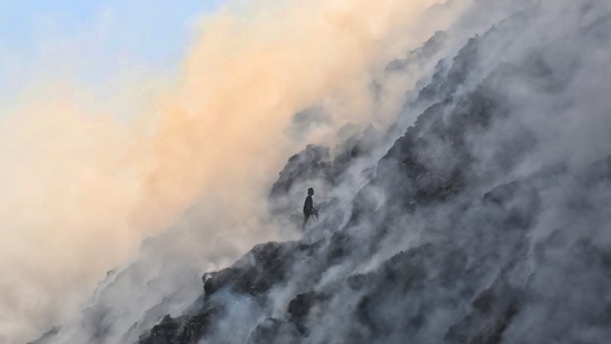 Gyan Sarovar School, a child resource centre for underprivileged children of rag-pickers living near the Bhalswa landfill site in north Delhi, has been closed for a week due to a massive fire in the area.(HT Photo/Sanchit Khanna)