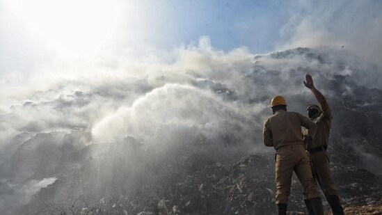 Dousing operations underway at Bhalswa landfill on Wednesday. (Sanchit Khanna/HT)