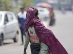 A girl covers her face with a scarf to protect herself from the sun on a hot summer afternoon in the outskirts of Jammu, India, Thursday, April 28, 2022. (AP Photo/Channi Anand) (AP) A girl covers her face with a scarf to protect herself from the sun on a hot summer afternoon in the outskirts of Jammu, India, Thursday, April 28, 2022. (AP Photo/Channi Anand) (AP)