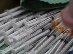 Doses of Moderna Covid-19 vaccine shots at a vaccination facility.