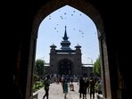 Visitors and Muslim devotees gather to offer Friday prayers during the holy fasting month of Ramadan at Jamia Masjid in downtown Srinagar on April 8, 2022. (Photo by TAUSEEF MUSTAFA/AFP)
