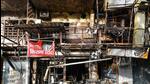 A view of the charred remains of a building that caught fire in Amar Colony, New Delhi, on Tuesday. (Amal KS/HT Photo)