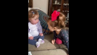 The image, taken from the Instagram video, shows the kid’s reaction to meeting her sister. (Instagram/@makingmilliestones)