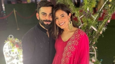 Anushka Sharma and Virat Kohli posing at Glenn Maxwell's wedding function in Mumbai.