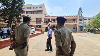 Police personnel stand guard outside Clarence High School. (Ht Photo) Police personnel stand guard outside Clarence High School. (Ht Photo)