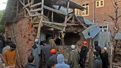 People gather around the encounter site in Pulwama on Thursday. (ANI) People gather around the encounter site in Pulwama on Thursday. (ANI)