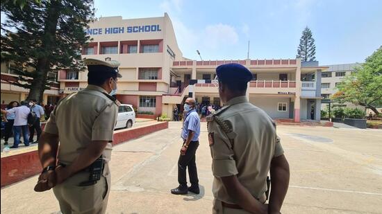 Police personnel stand guard outside Clarence High School. (Ht Photo)