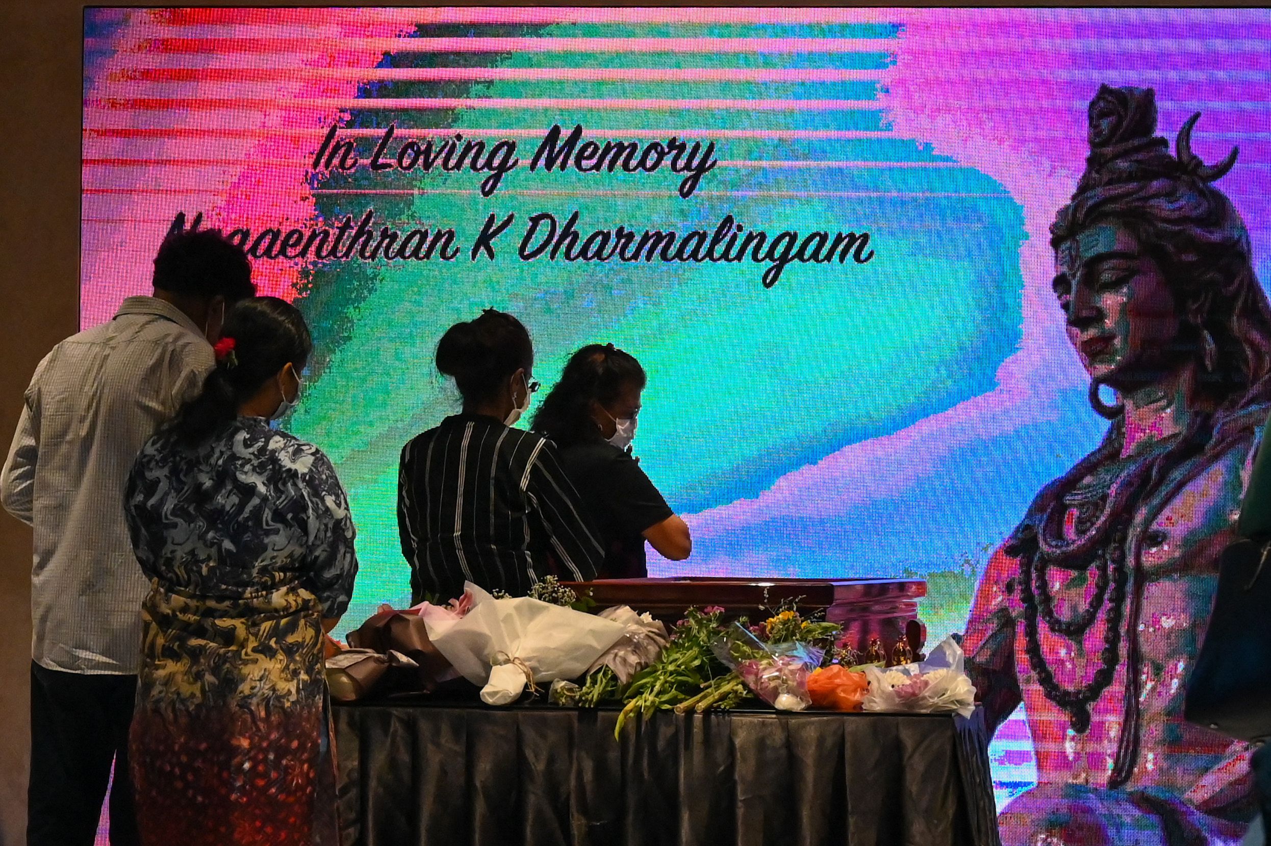 People pay tribute at a wake for Malaysian national Nagaenthran K. Dharmalingam, who was executed for trafficking heroin into Singapore, during a memorial service in Singapore on April 27, 2022. (AFP) People pay tribute at a wake for Malaysian national Nagaenthran K. Dharmalingam, who was executed for trafficking heroin into Singapore, during a memorial service in Singapore on April 27, 2022. (AFP)