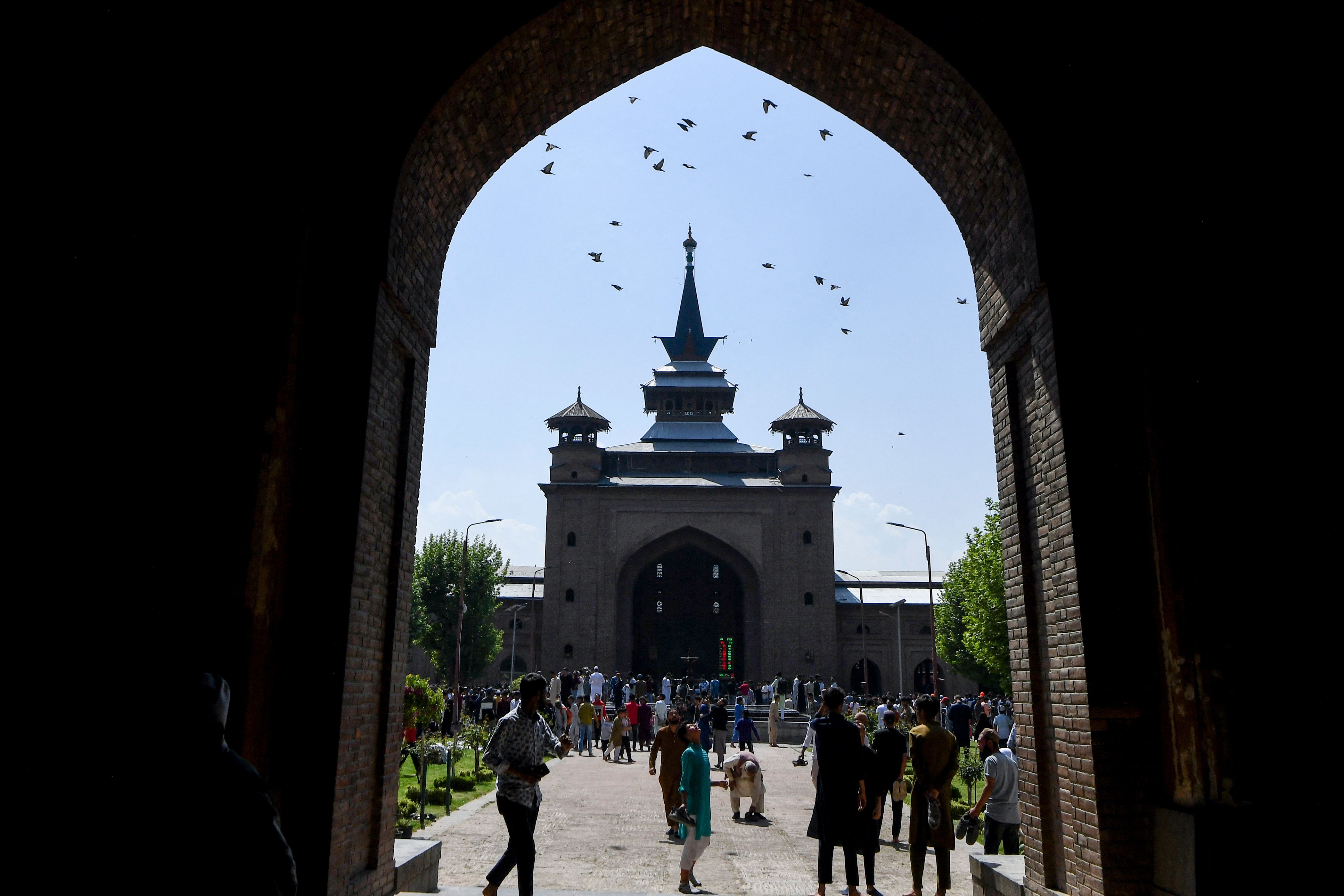 Visitors and Muslim devotees gather to offer Friday prayers during the holy fasting month of Ramadan at Jamia Masjid in downtown Srinagar on April 8, 2022. (Photo by TAUSEEF MUSTAFA/AFP)