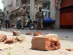 Police personnel patrol the street to maintain law and order after the clash that erupted between two groups near Kali Devi Temple in Patiala on Friday. (ANI Photo)(Harmeet Sodhi) Police personnel patrol the street to maintain law and order after the clash that erupted between two groups near Kali Devi Temple in Patiala on Friday. (ANI Photo)(Harmeet Sodhi)