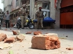 Police personnel patrol the street to maintain law and order after the clash that erupted between two groups near Kali Devi Temple, in Patiala on Friday. (ANI Photo)(Harmeet Sodhi)