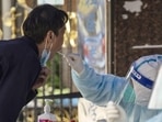 A resident takes part in a round of Covid-19 testing during a lockdownin Shanghai, China (Bloomberg) A resident takes part in a round of Covid-19 testing during a lockdownin Shanghai, China (Bloomberg)