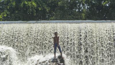 Karad: A boy reacts as he cools off in the Khodashi dam, during a hot summer day in Karad, (PTI) Karad: A boy reacts as he cools off in the Khodashi dam, during a hot summer day in Karad, (PTI)