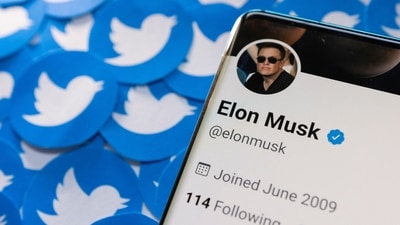 Elon Musk's Twitter profile is seen on a smartphone placed on printed Twitter logos in this picture illustration taken April 28, 2022. REUTERS/Dado Ruvic/Illustration (REUTERS)