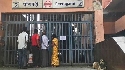 New Delhi: Commuters wait outside closed Peera Garhi metro station in New Delhi, Thursday, March 17, 2022. (PTI Photo) (PTI) New Delhi: Commuters wait outside closed Peera Garhi metro station in New Delhi, Thursday, March 17, 2022. (PTI Photo) (PTI)