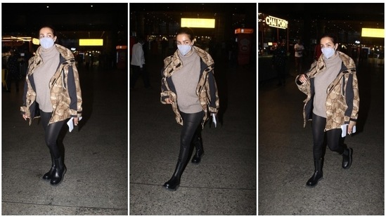 Malaika Arora, who was recently vacationing in the United States, gave major airport fashion goals as she arrived in Mumbai airport in a Gucci jacket layered over a turtle neck greige sweater.(HT Photo/Varinder Chawla)