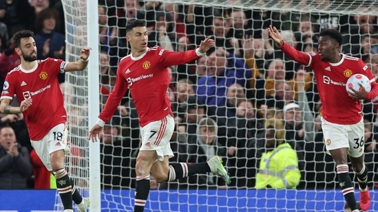Manchester United's Cristiano Ronaldo celebrates scoring their first goal with Anthony Elanga and Bruno Fernandes.(REUTERS)