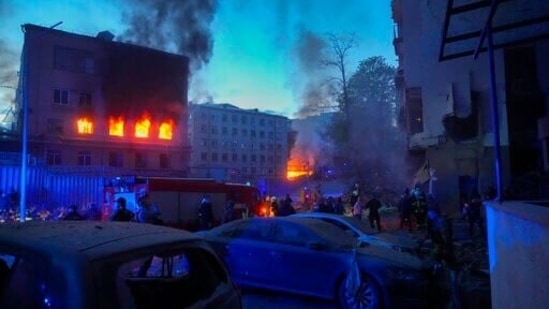 Firefighters put out a fire after a Russian rocket attack in Kyiv. Russia mounted attacks across a wide area of Ukraine on Thursday, bombarding Kyiv during a visit by the head of the United Nations.&nbsp;(AP)