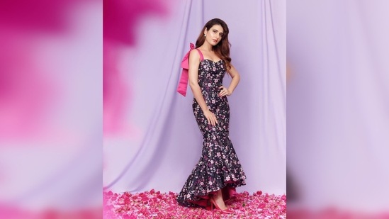 Fatima Sana Shaikh's dress features pink ribbon tie-up straps and mermaid-inspired ruffle bottoms.(Instagram/@fatimasanashaikh)