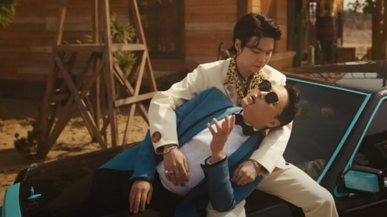 A still from Psy and Suga's That That music video that has been turned into a meme.