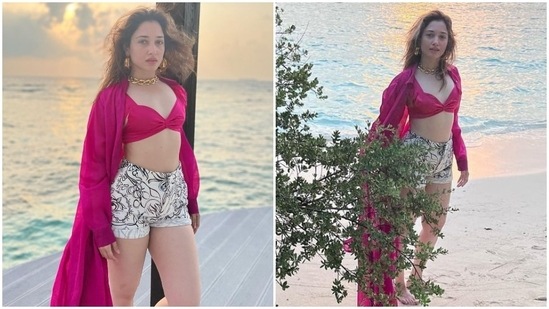 Taking beach fashion to a whole new level, Tamannaah Bhatia stunned in this fuschia pink bikini top and white printed shorts as she vacations in the Maldives.(Instagram/@tamannaahspeaks)