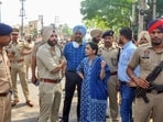 DC Sakshi Sawhney along with SSP Nanak Singh outside Kali Mata temple, a day after clashes broke out between two groups, in Patiala, Punjab, on Saturday, April 30, 2022. (PTI Photo)