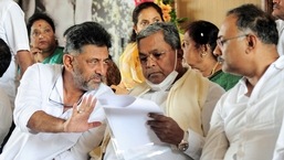 Bengaluru, Apr 15 (ANI): Karnataka Congress President DK Shivakumar interacting with Leader of Opposition in Karnataka Legislative Assembly Siddaramaiah during a press meet demanding the arrest of State Rural Development Minister KS Eshwarappa alleging his involvement in the suicide case of contractor Santosh Patil, in Bengaluru on Friday.  (ANI Photo) 