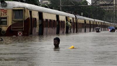 Mumbai Monsoon Floods - A man walks through a submerged railway track at Chunabhatti station on Wednesday. (11.30am). Thousands of people were stranded in their offices, railway stations, trains, buses and even schools following incessant rains. HT Photo by Vijayanand Gupta. 27/07/05 Mumbai Monsoon Floods - A man walks through a submerged railway track at Chunabhatti station on Wednesday. (11.30am). Thousands of people were stranded in their offices, railway stations, trains, buses and even schools following incessant rains. HT Photo by Vijayanand Gupta. 27/07/05