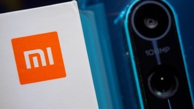 Xiaomi logo is seen next to a smartphone of the same brand in this illustration taken September 28, 2021. REUTERS/Dado Ruvic (REUTERS)