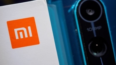 Xiaomi logo is seen next to a smartphone of the same brand in this illustration taken September 28, 2021. REUTERS/Dado Ruvic (REUTERS)