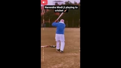 Fact Check: The image is taken from the viral video shared with a false claim that it shows PM Narendra Modi playing cricket. (Screengrab) Fact Check: The image is taken from the viral video shared with a false claim that it shows PM Narendra Modi playing cricket. (Screengrab)
