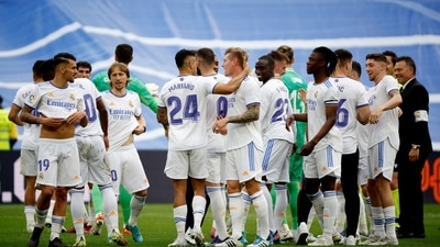 Real Madrid's Daniel Ceballos, Mariano Diaz, Ferland Mendy, Eduardo Camavinga and team members celebrate after winning LaLiga (REUTERS)