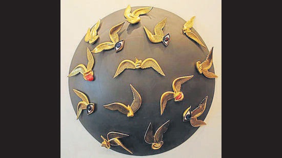 This sculpture by Manish Sharma, Reverberations, is made of wood, fibre glass and pure gold. (Photo: Manoj Verma/HT)