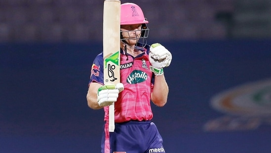 Rajasthan Royals Jos Buttler raises his bat after scoring a half century during the Indian Premier League 2022 cricket match between Rajasthan Royals and Mumbai Indians, at the DY Patil Stadium in Mumbai on Saturday.(ANI)