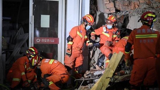 Rescue workers work at a site where a building collapsed in Changsha, Hunan province, China April 29, 2022.&nbsp;(VIA REUTERS)