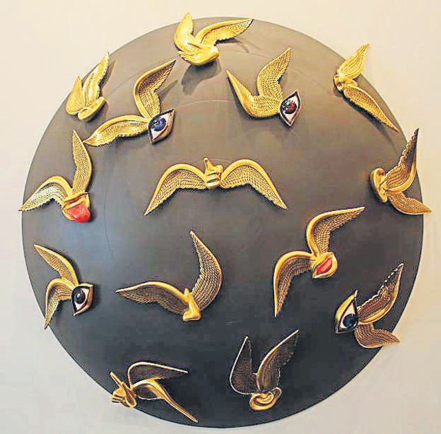 This sculpture by Manish Sharma, Reverberations, is made of wood, fibre glass and pure gold. (Photo: Manoj Verma/HT)