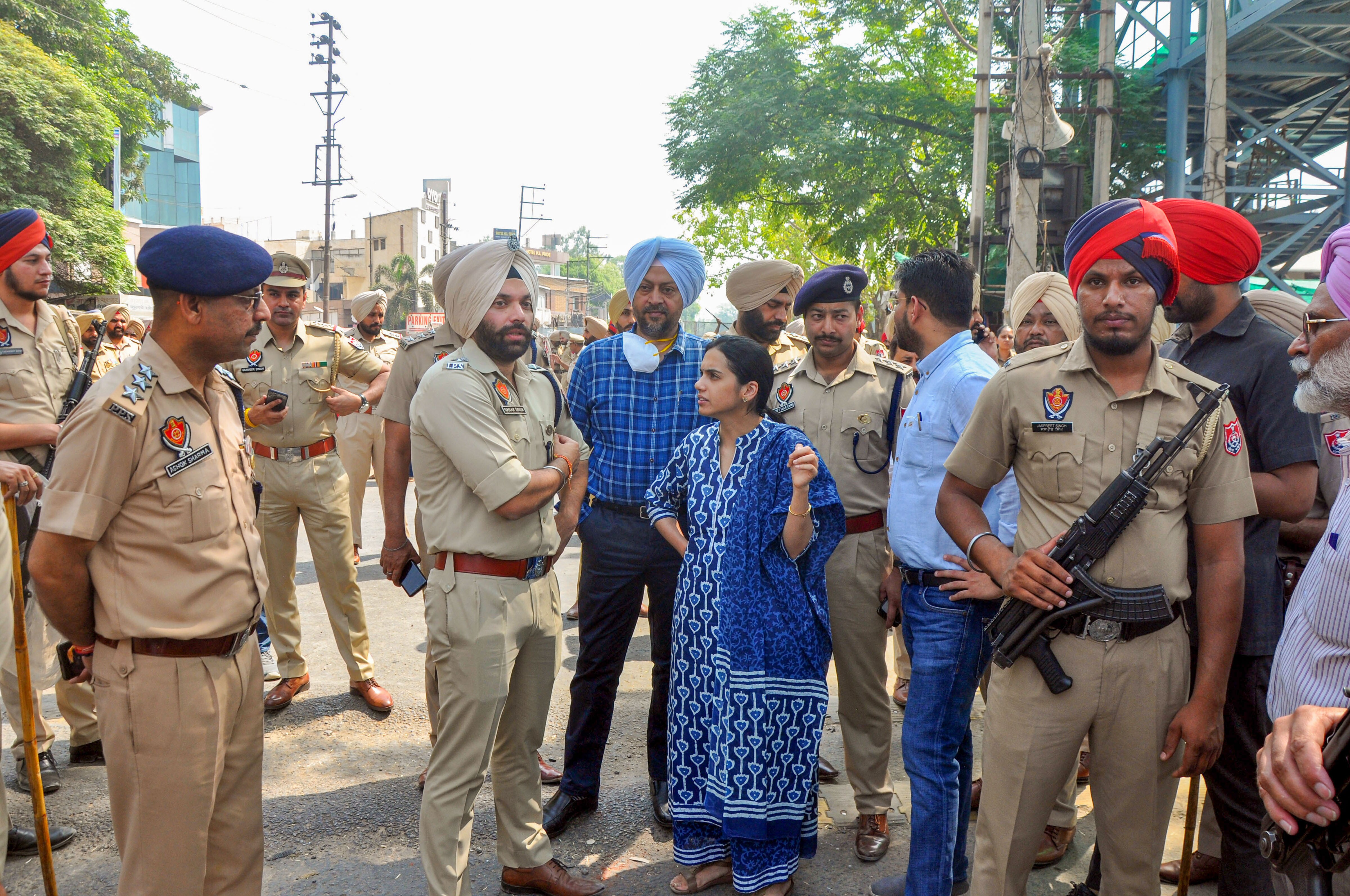 DC Sakshi Sawhney along with SSP Nanak Singh outside Kali Mata temple, a day after clashes broke out between two groups, in Patiala, Punjab, on Saturday, April 30, 2022. (PTI Photo) DC Sakshi Sawhney along with SSP Nanak Singh outside Kali Mata temple, a day after clashes broke out between two groups, in Patiala, Punjab, on Saturday, April 30, 2022. (PTI Photo)