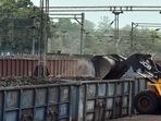 Coal being loaded in good train amid a power crisis due to shortage of coal, at Rai Coal mines in Peeparwar.